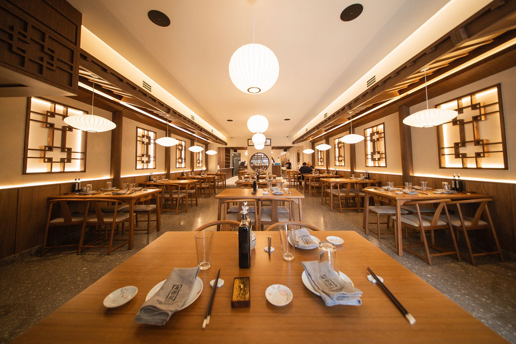 The warm wood dining room at QXY