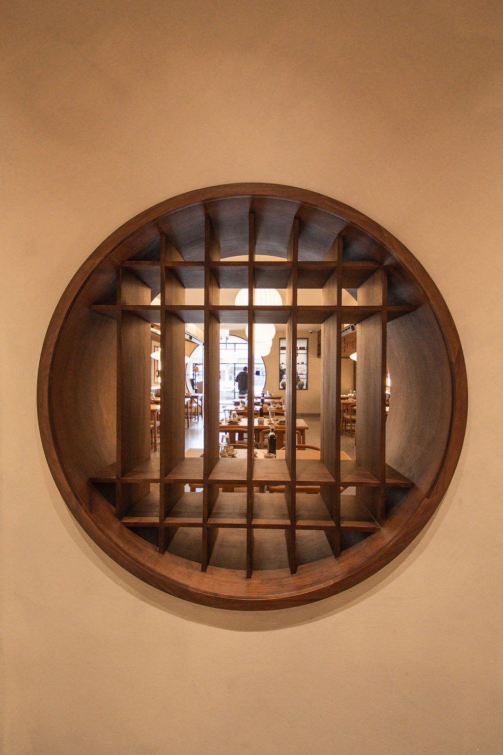 The circular wooden window inside QXY